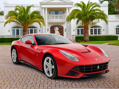 2012 Ferrari F12 Berlinetta Red 3/4 Front View On Brick By Mansion